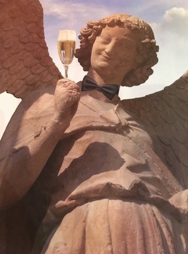Picture of angel statue holding glass of champagne