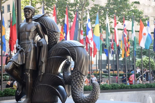 Statue and flags in Rockefeller Center