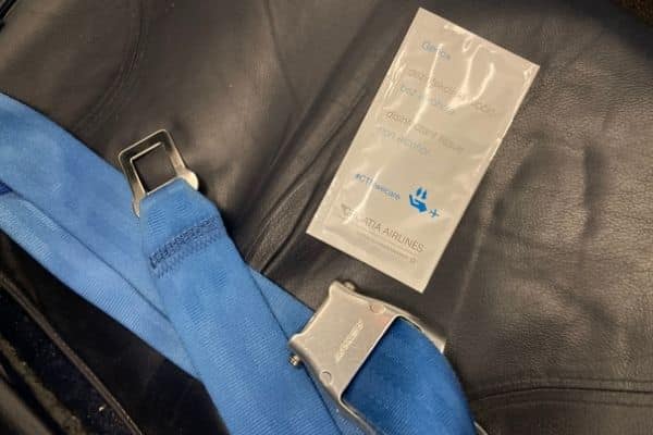 Airline hand sanitizer wipes on seat