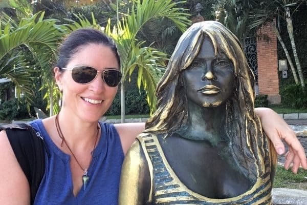 Gwen with statue in Buzios Brazil