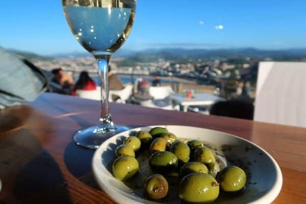 Green olives and white wine San Sebastian Spain