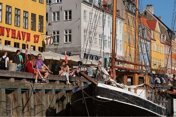 Nyhavn and people from canal cruise Copenhagen