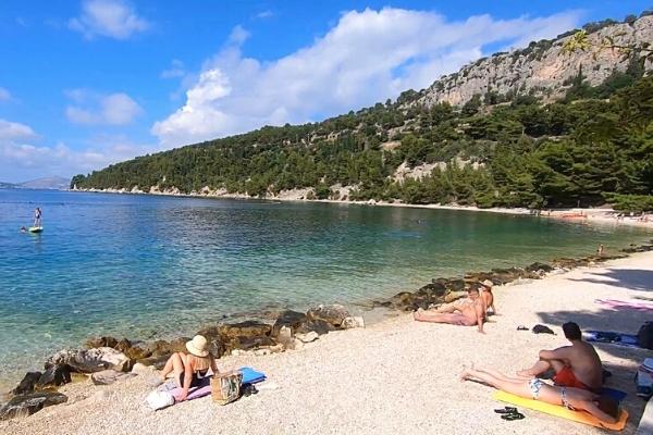 People on Kasjuni Beach Split best beach destination for solo travelers in Europe
