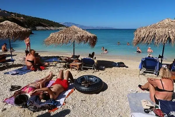 Sunbathers on Xigia Sulfur Beach Zakynthos best beach destination for solo travelers in Europe