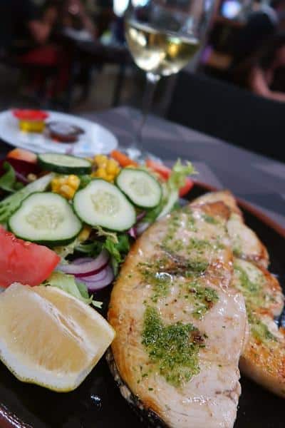 Grilled fish dinner and wine Madrid solo dining