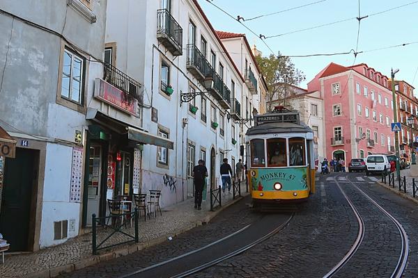 Tram 28 going downhill in Alfama Lisbon