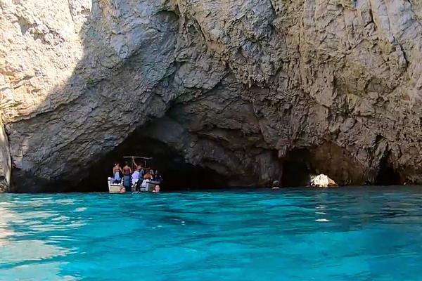 Boaters in Marathonisi Caves Turtle Island Zakynthos