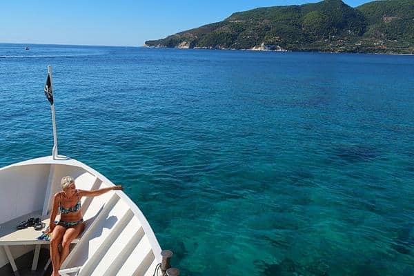 Lady in bikini on boat Zakynthos Greece