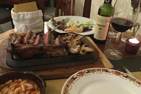 Florentine steak dinner with wine Florence Italy