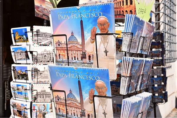 Rack of Pope souvenirs Vatican City