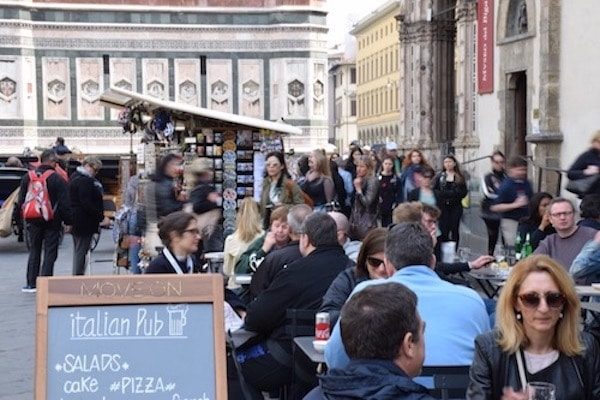 People dining in Piazza del Duomo Florence Italy
